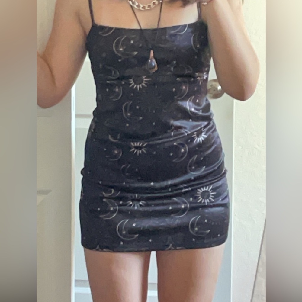 Urban Outfitters black and gold dress with a celestial print